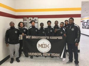 my brother's keeper boys holding MBK banner