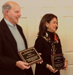 Dr. Maria Lagana Suttmeier hold award plaque next to another award recipient