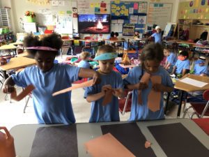 elementary students make camp fire from construction paper