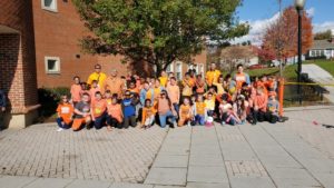 staff and students wearing orange t-shirts