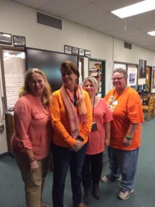 school staff wearing orange t-shirts