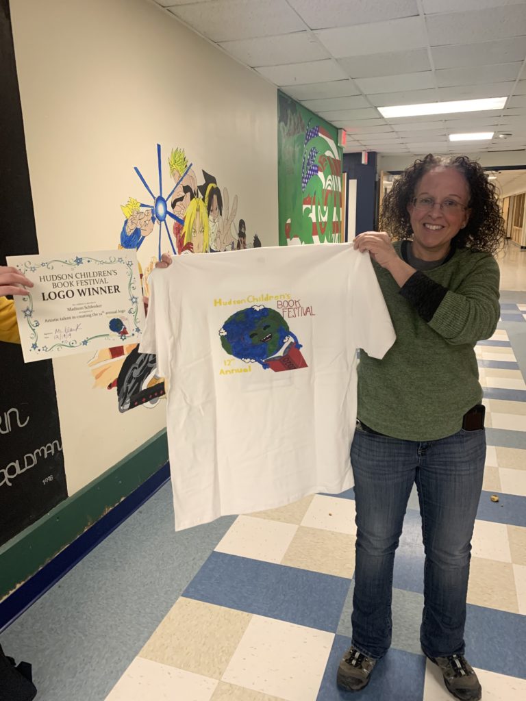 Ms. Albino holds t-shirt