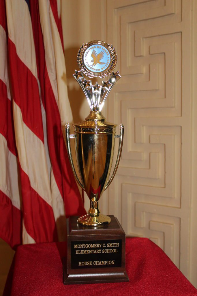 trophy on a covered pedestal