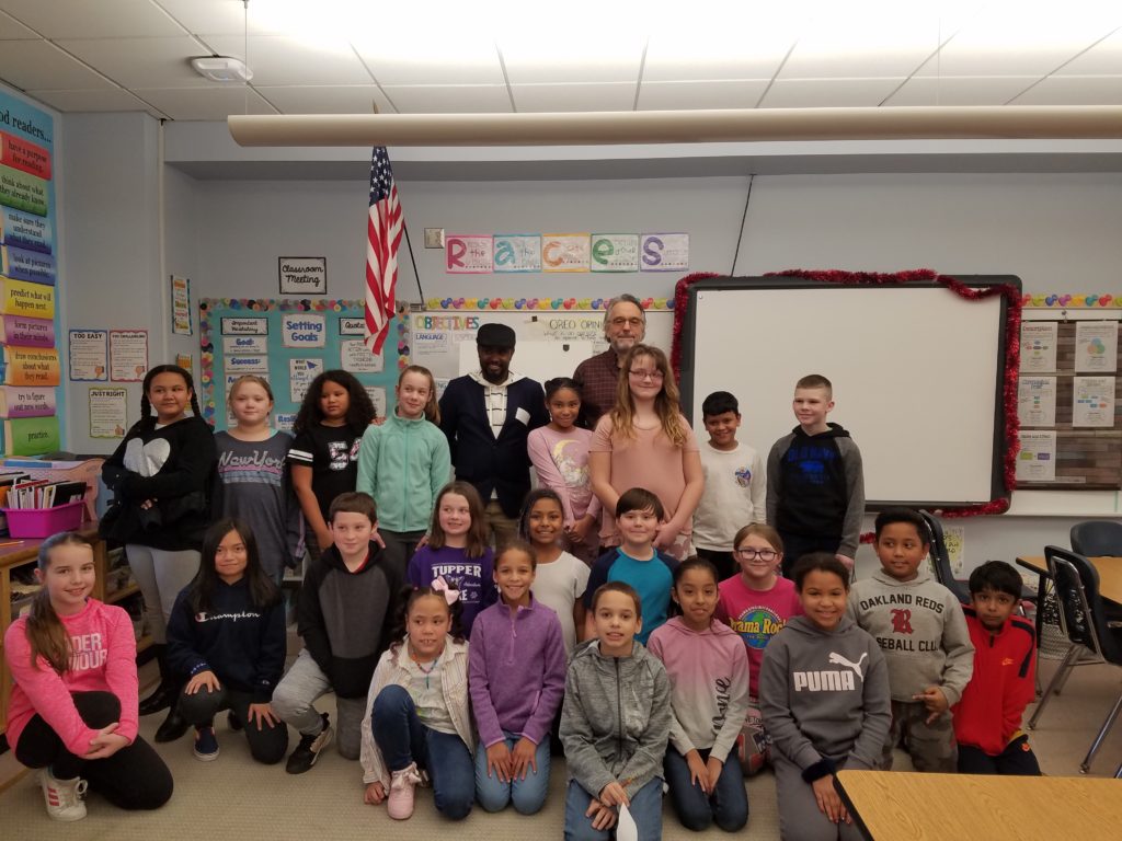 group photo of students in a classroom