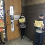 elementary students holding Honesty/Trustworthiness Certificate