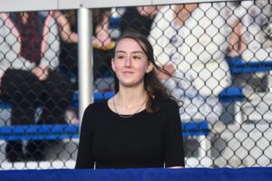 female student at outdoor podium