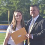 Principal Reardon and 8th grade graduate