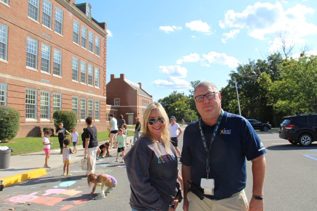 Three teachers on their computers